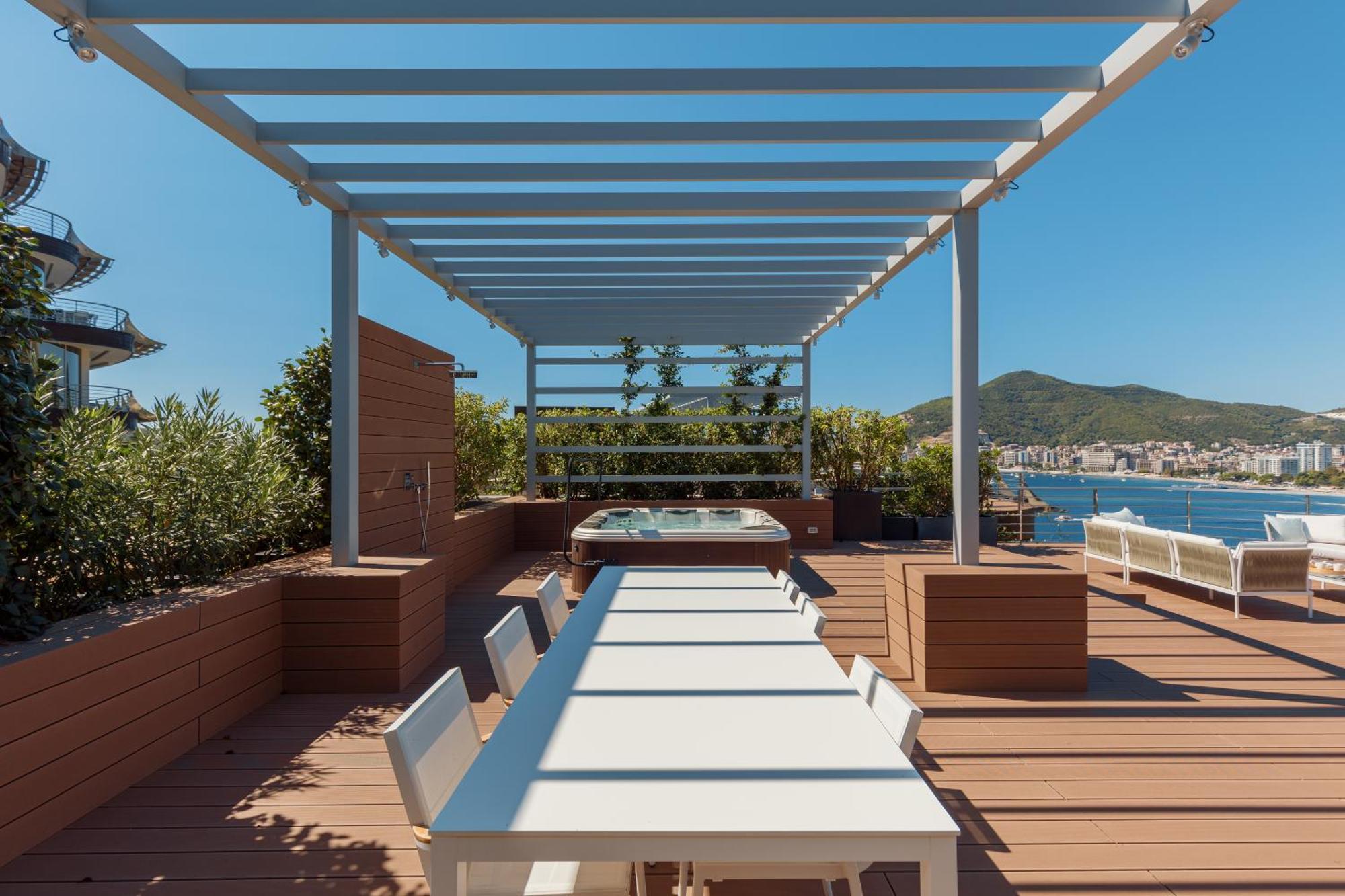 Penthouse Four-Bedroom Apartment with Rooftop Terrace and Sea View